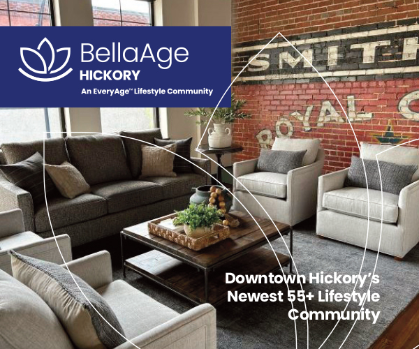 BellaAge common space featuring seating area in front of vintage mural